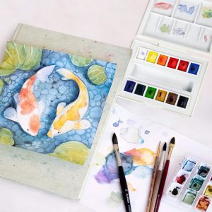 Boîte de voyage la petite aquarelle - 12 demi-godets - Idéal pour lavis - 1 mini pinceau inclus -  Sennelier